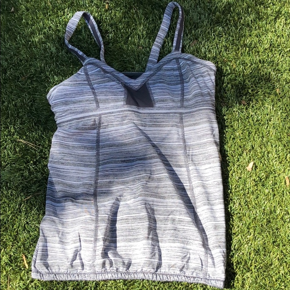Gray athletic top from lululemon.  Pocket in back